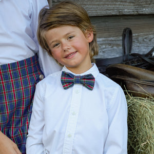 Boys’ pre-tied Baker Bow Tie in navy, red, and green Tinsel Tartan with subtle metallic thread and easy-on clasp.