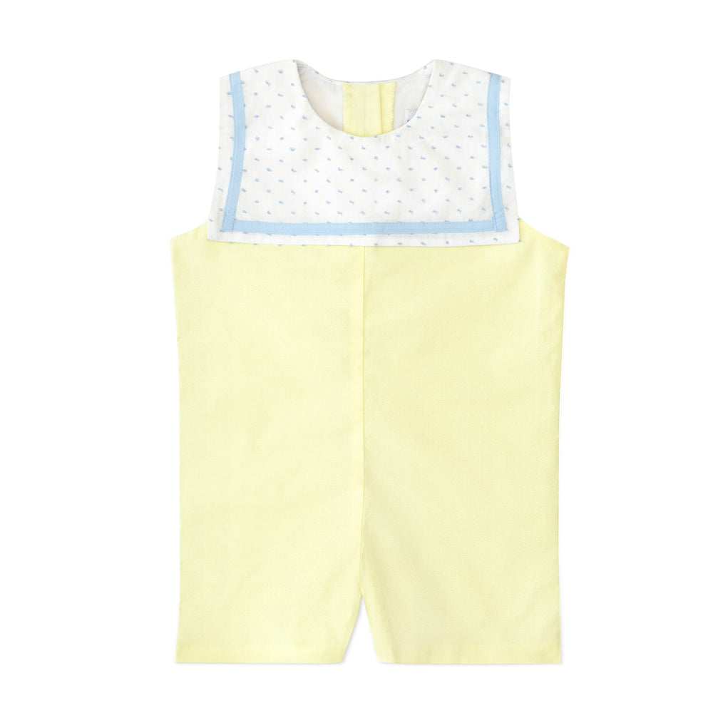 Front flat lay of Saylor Jon Jon showcasing sunshine yellow fabric and white Swiss dot sailor collar with blue trim on white