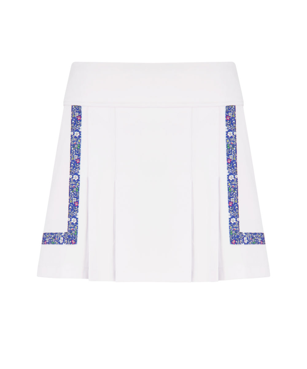 Front view of Heidi Golf Skort showcasing white fabric, blue floral side-and-hem trim and front pleats