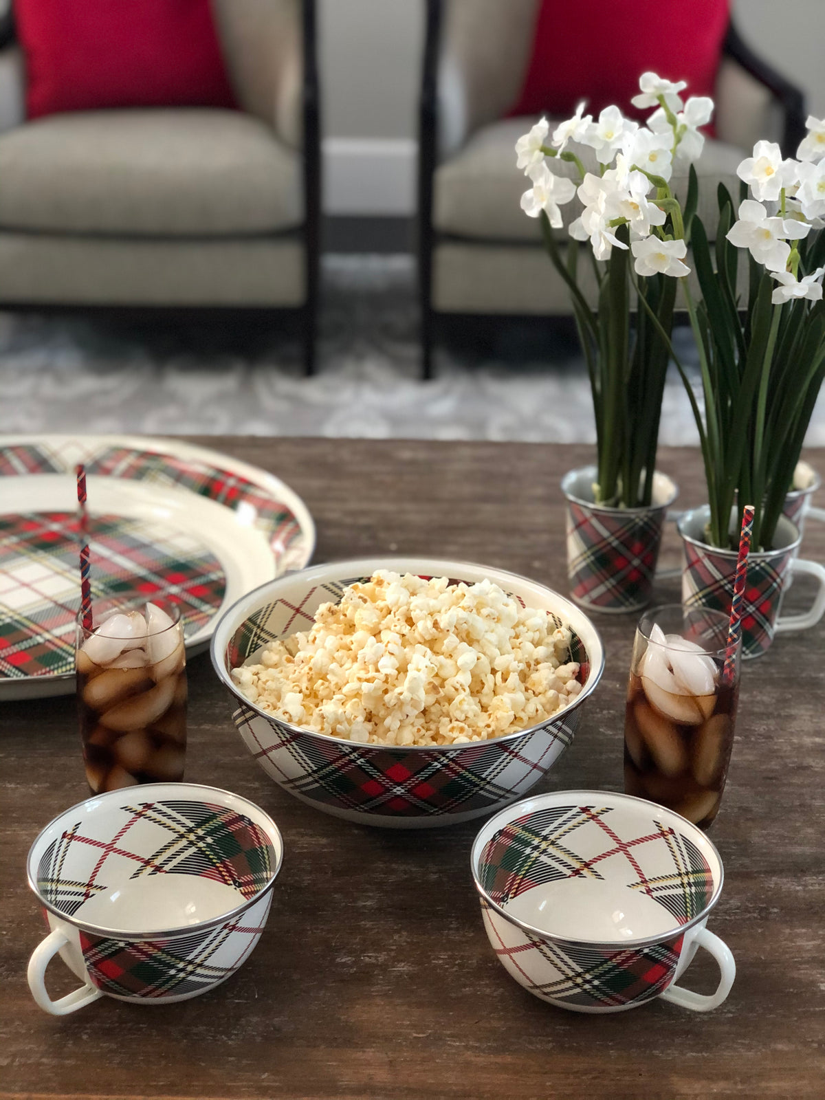 Front view of Large Tray in Highland Plaid showcasing its plaid enamel surface and stainless trim with popcorn on a dining table