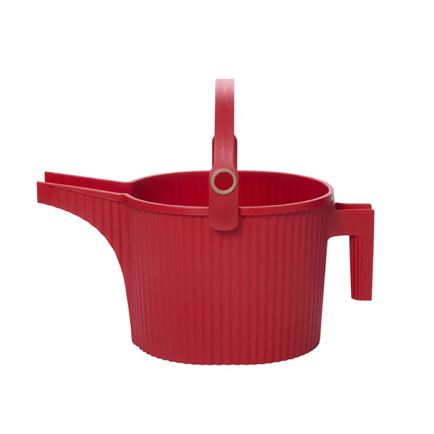 Front-side view of Hachiman Garden Beetle large watering can in red with ribbed body, grooved spout, and top loop handle