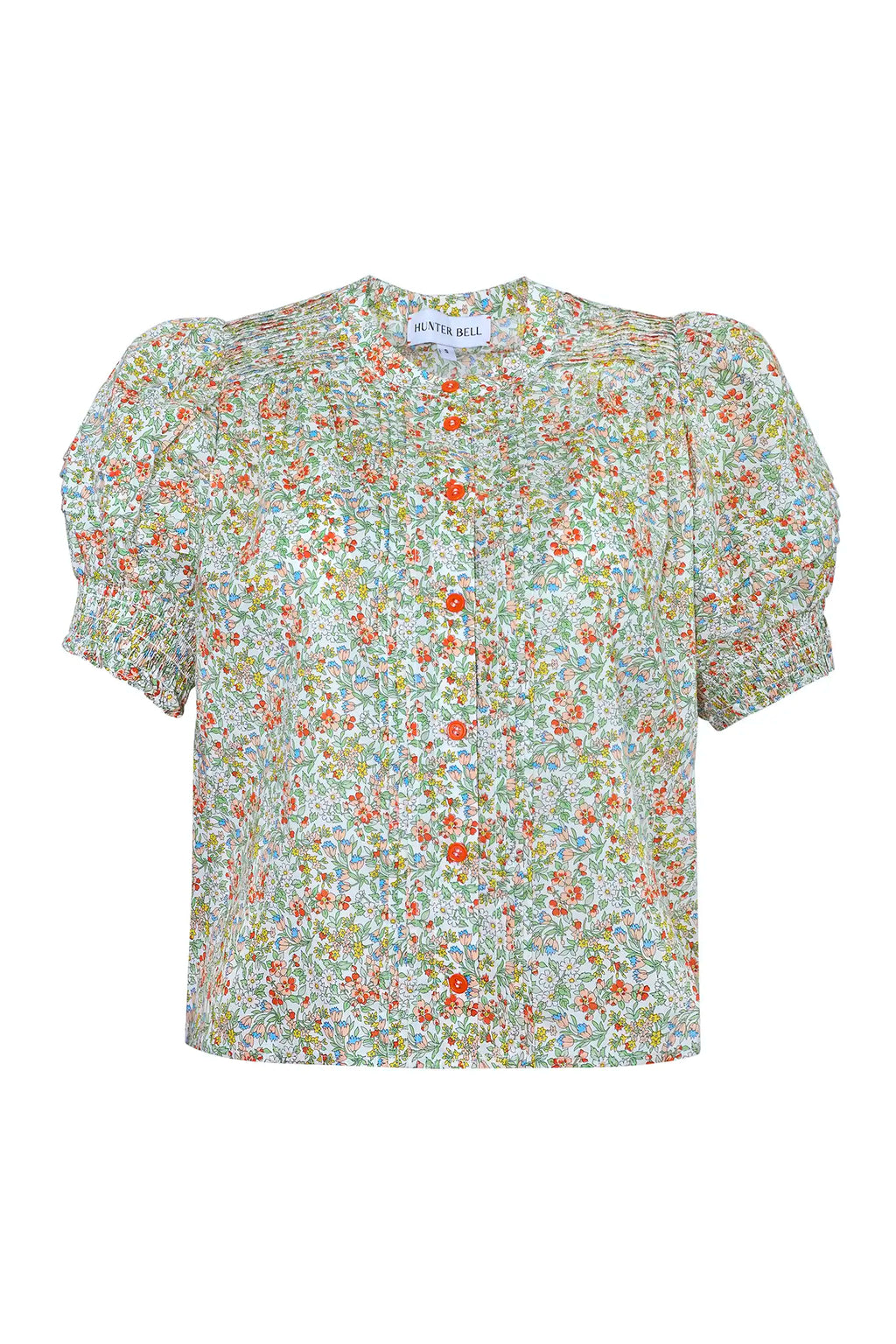 The Hartley Top in Coral Multi, puff sleeve blouse with coral buttons.