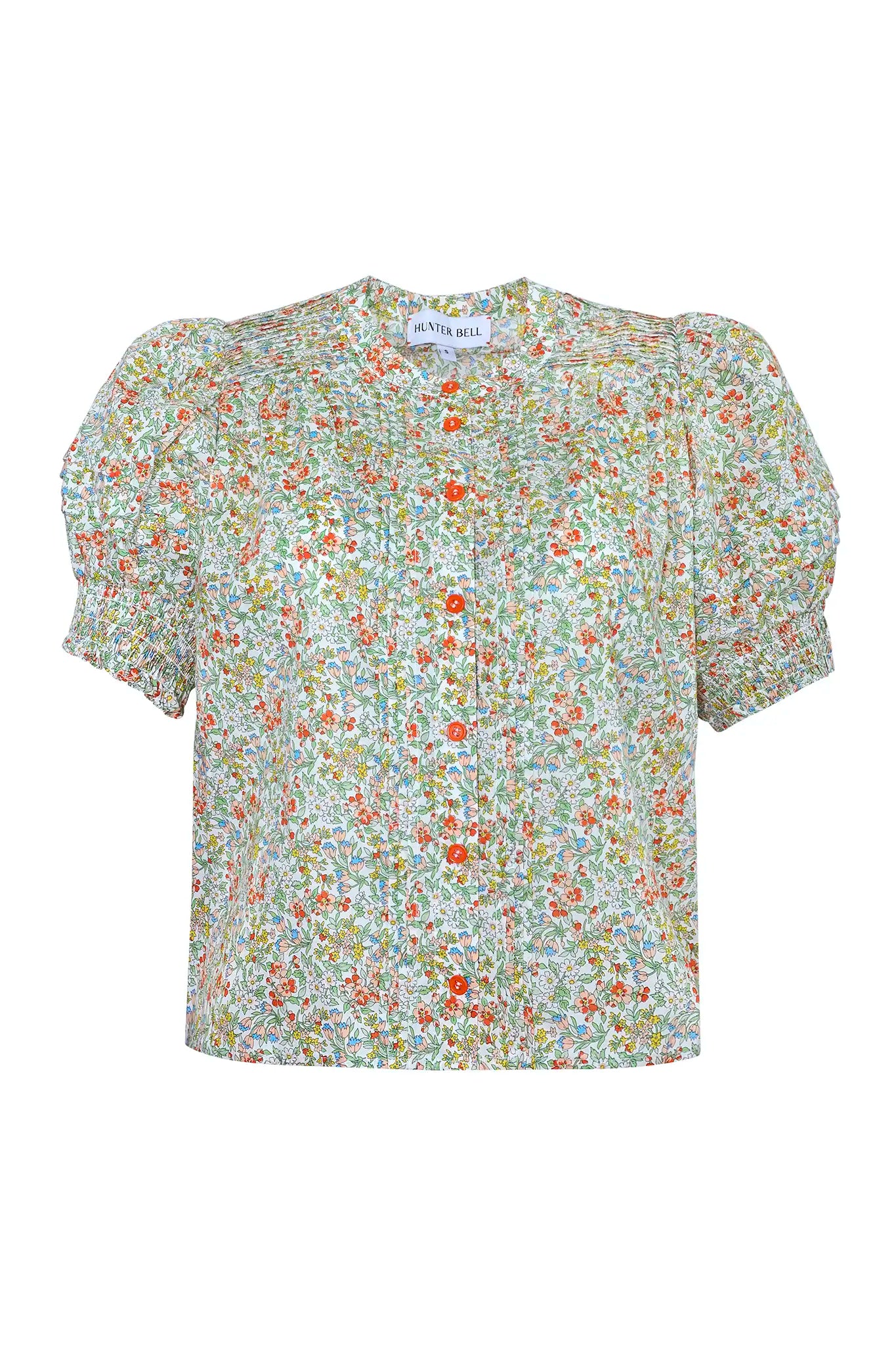 The Hartley Top in Coral Multi, puff sleeve blouse with coral buttons.
