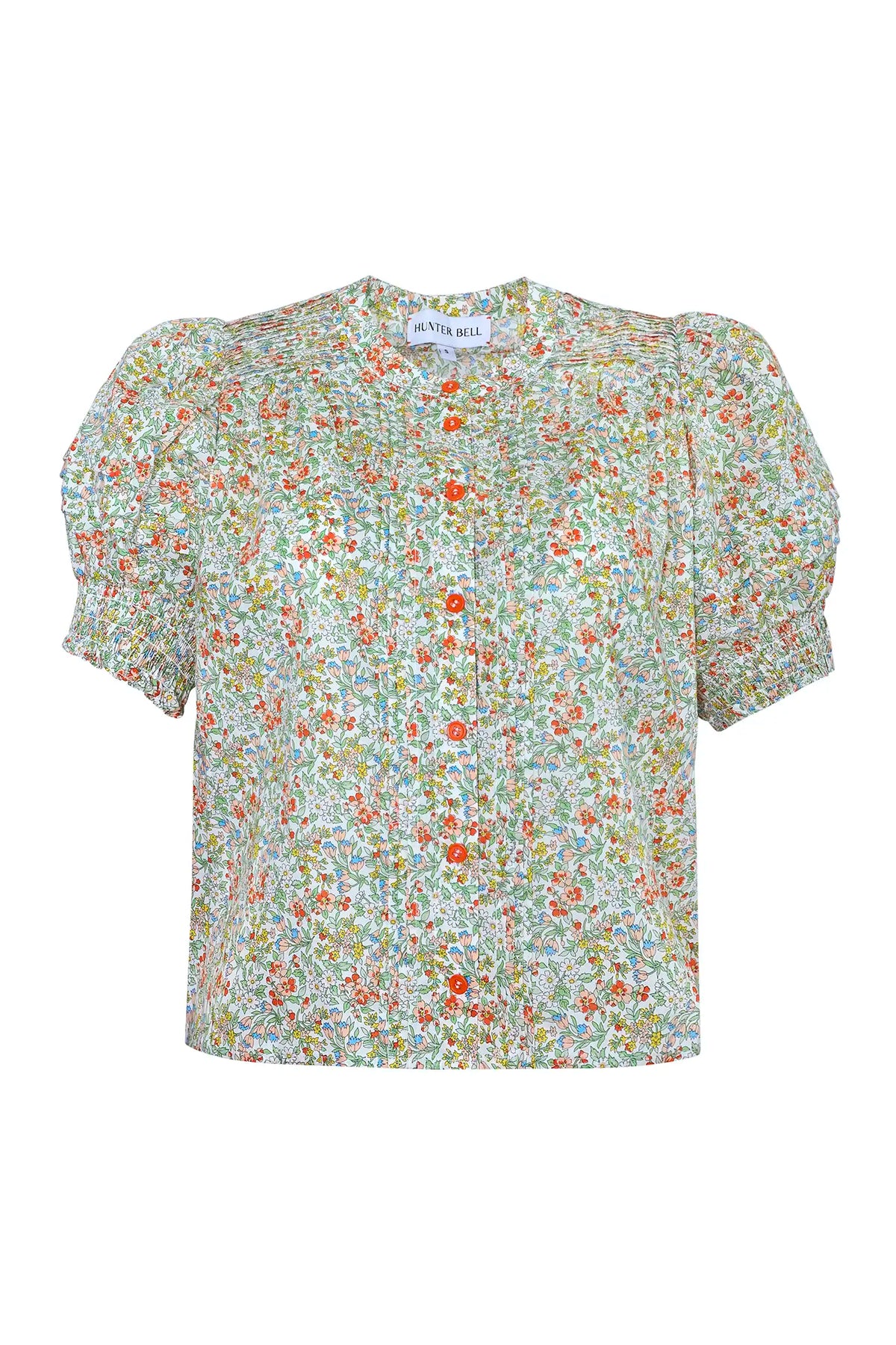 The Hartley Top in Coral Multi, puff sleeve blouse with coral buttons.