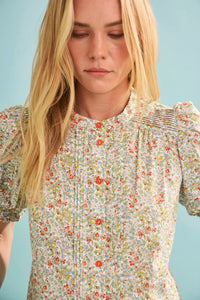 The Hartley Top in Coral Multi, puff sleeve blouse with coral buttons.