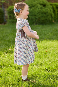 Little English traditional children's clothing. Short sleeve peter pan dress in blue, pink, and brown Wilmington Plaid with brown corduroy piping and bow details for little girls.
