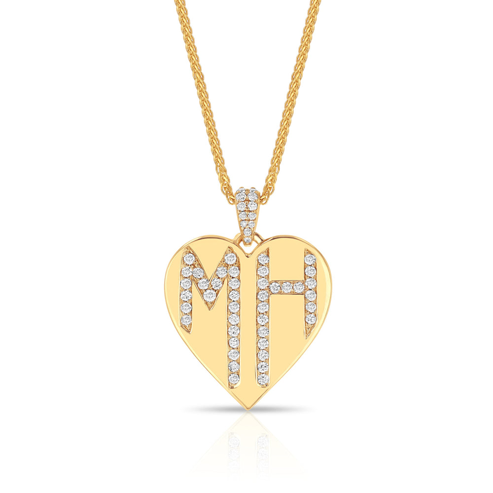 Front view of monogram heart necklace in 14k yellow gold with diamond initials MH on a white background