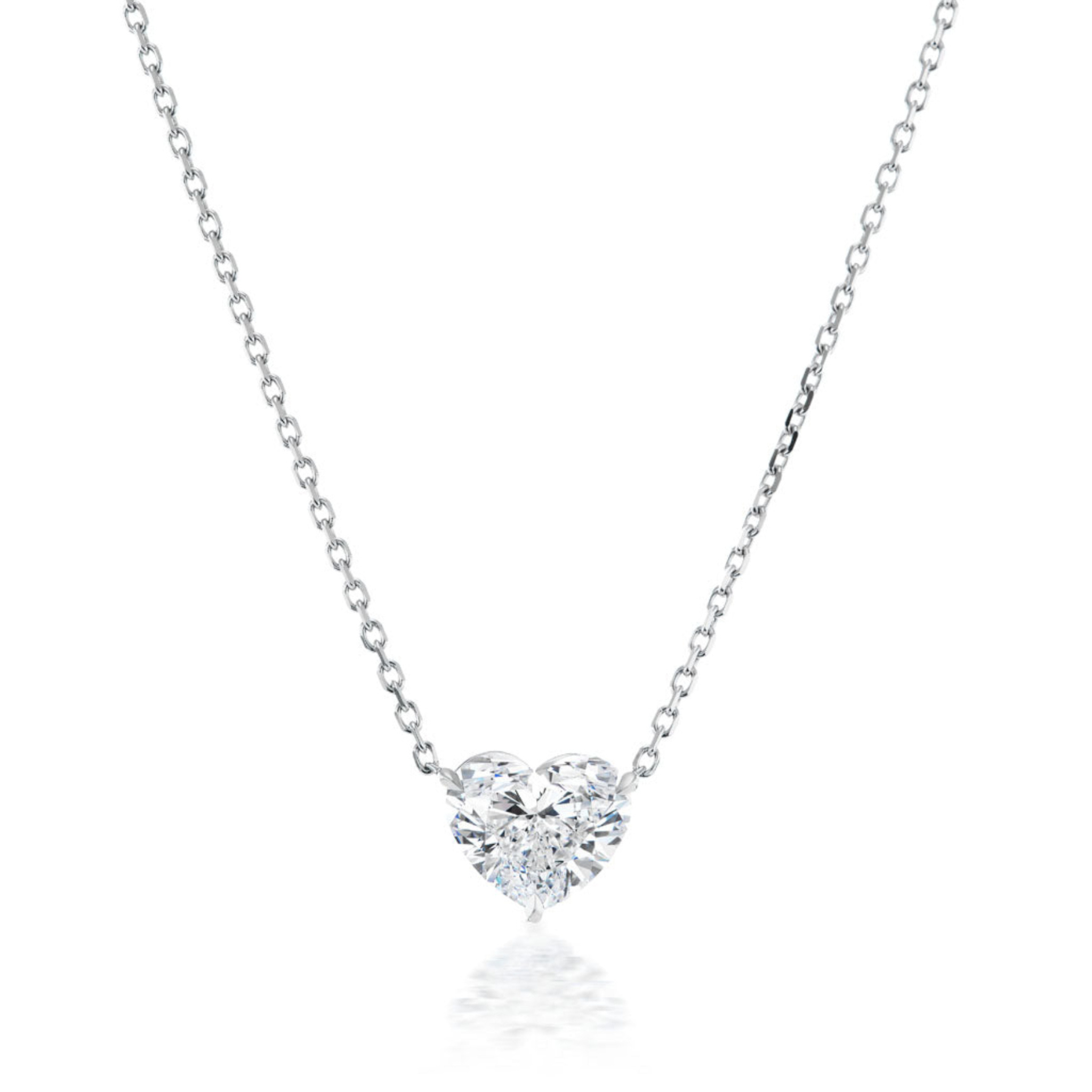 The Heart-Shaped Diamond Solitaire Pendant features a sparkling 1.71 carat diamond on a delicate silver chain, showcased against a white background.