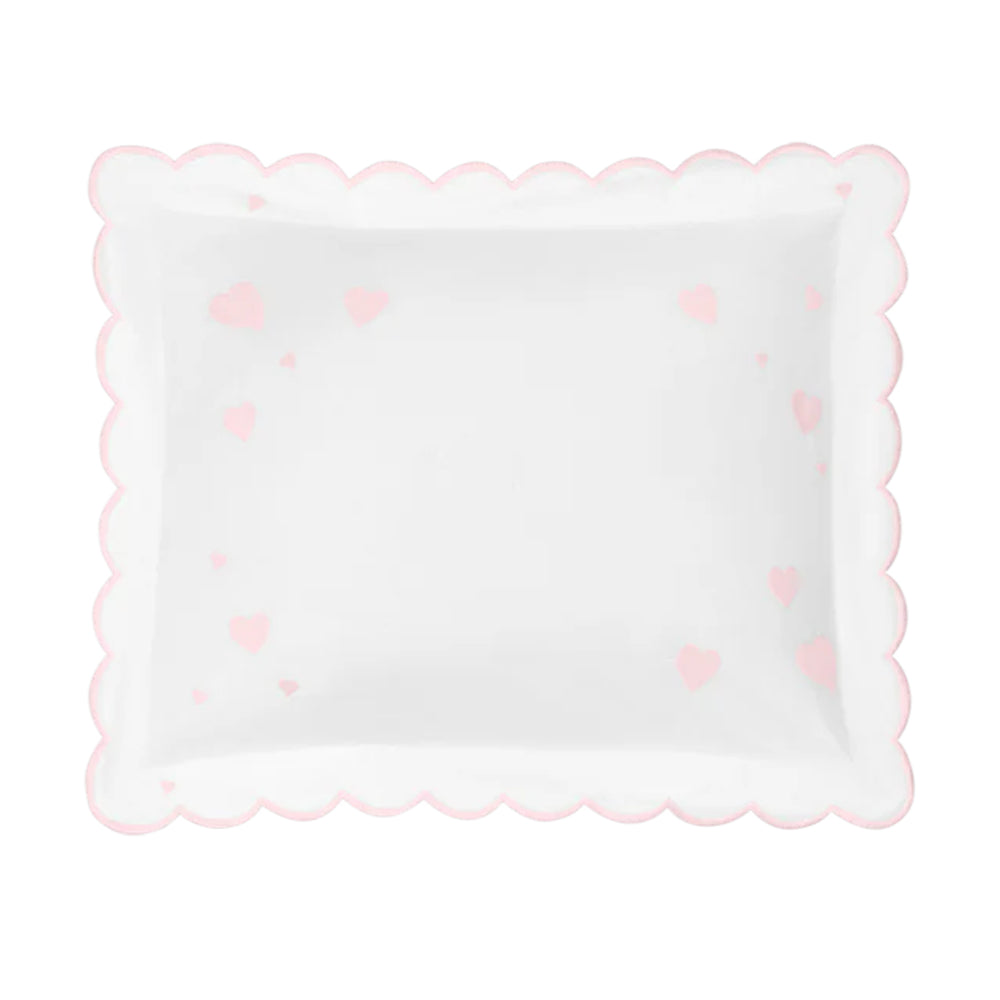 Top view of Hearts Mini Pillow showcasing scalloped pink edge and scattered pink heart motifs on white background