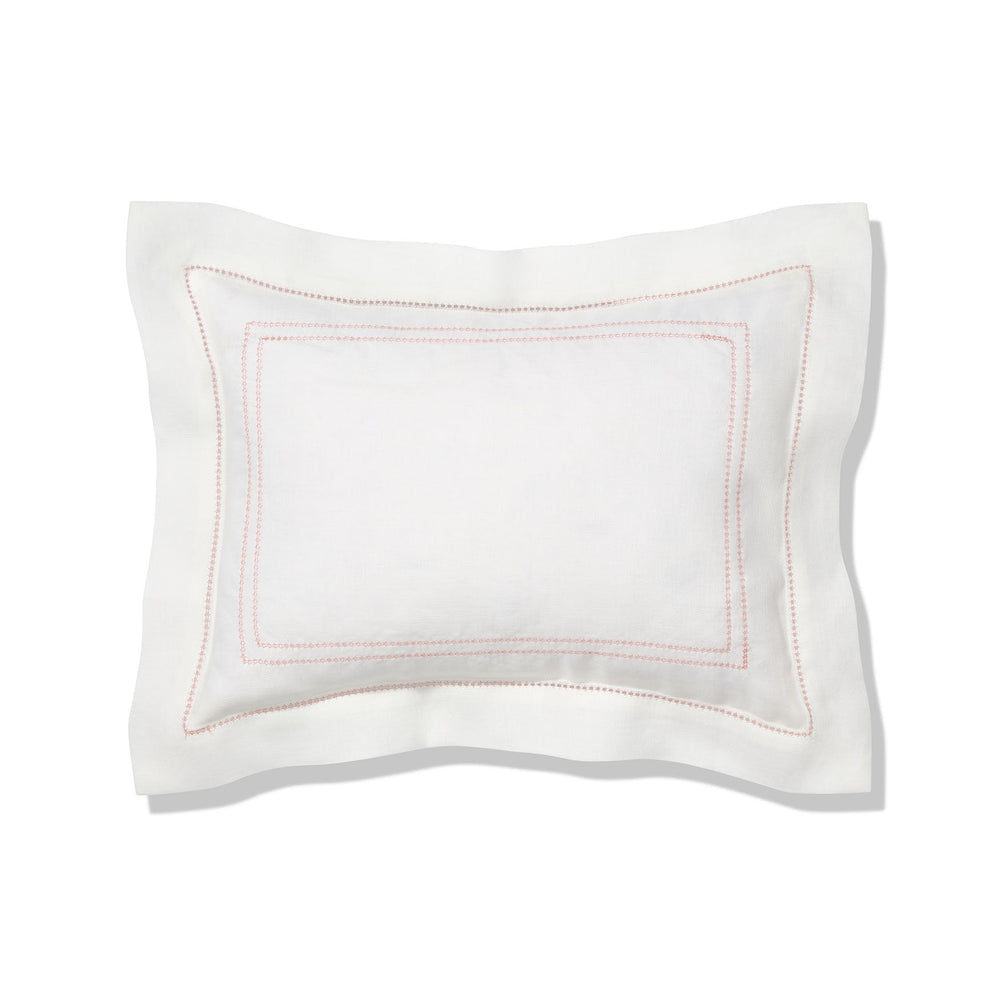 Front view of Elizaveta boudoir pillow showcasing coral hand-embroidered hemstitch and Oxford edge on a white background