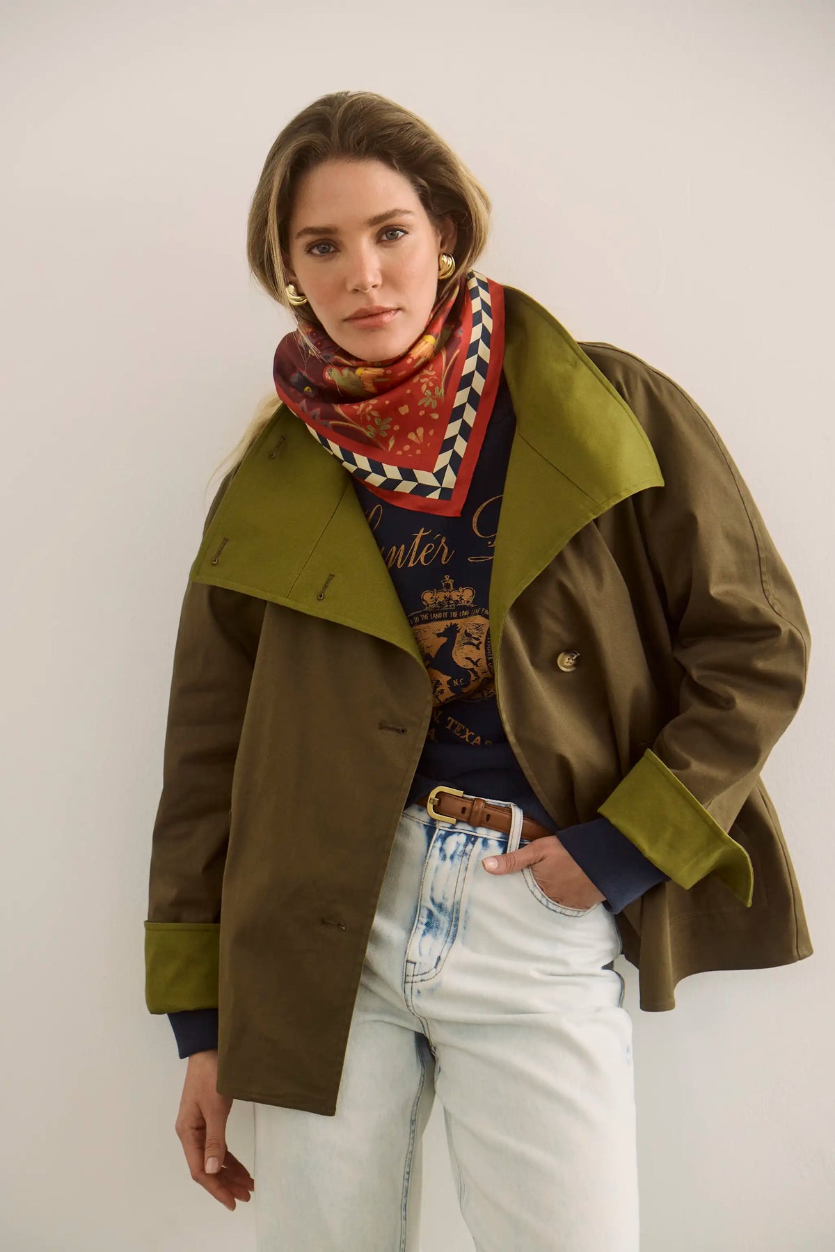 The Howell Cropped Trench paired with the Heritage Sweatshirt and Wray Pant in Washed Blue Denim.