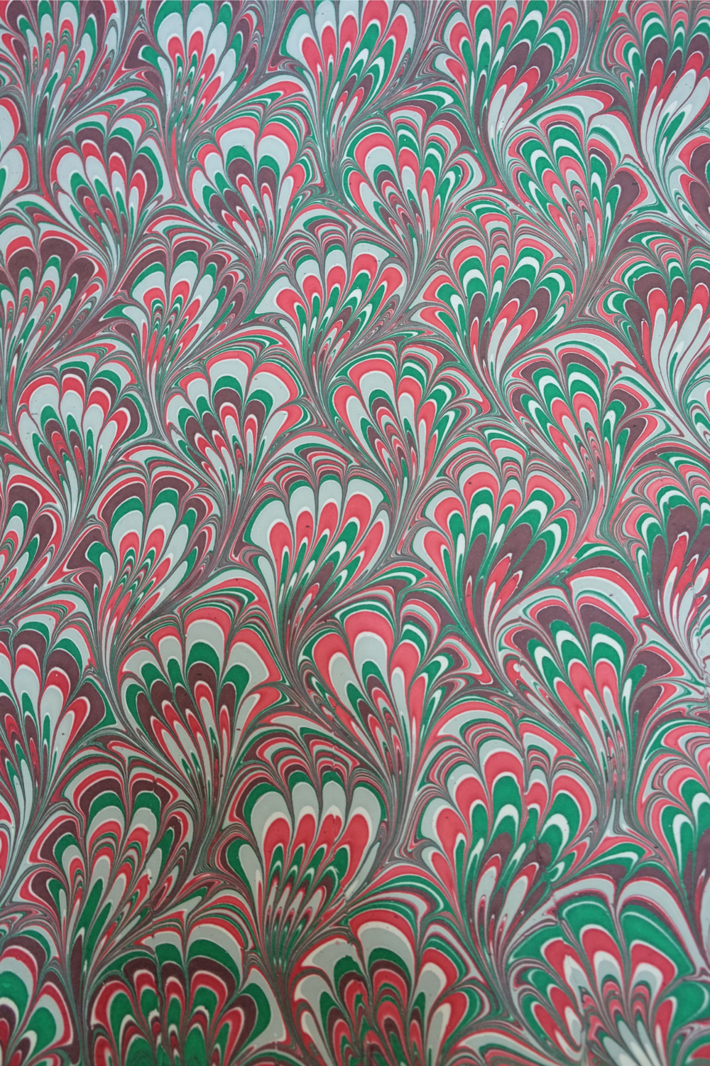 Hand marbled holiday festive gift wrapping paper pattern