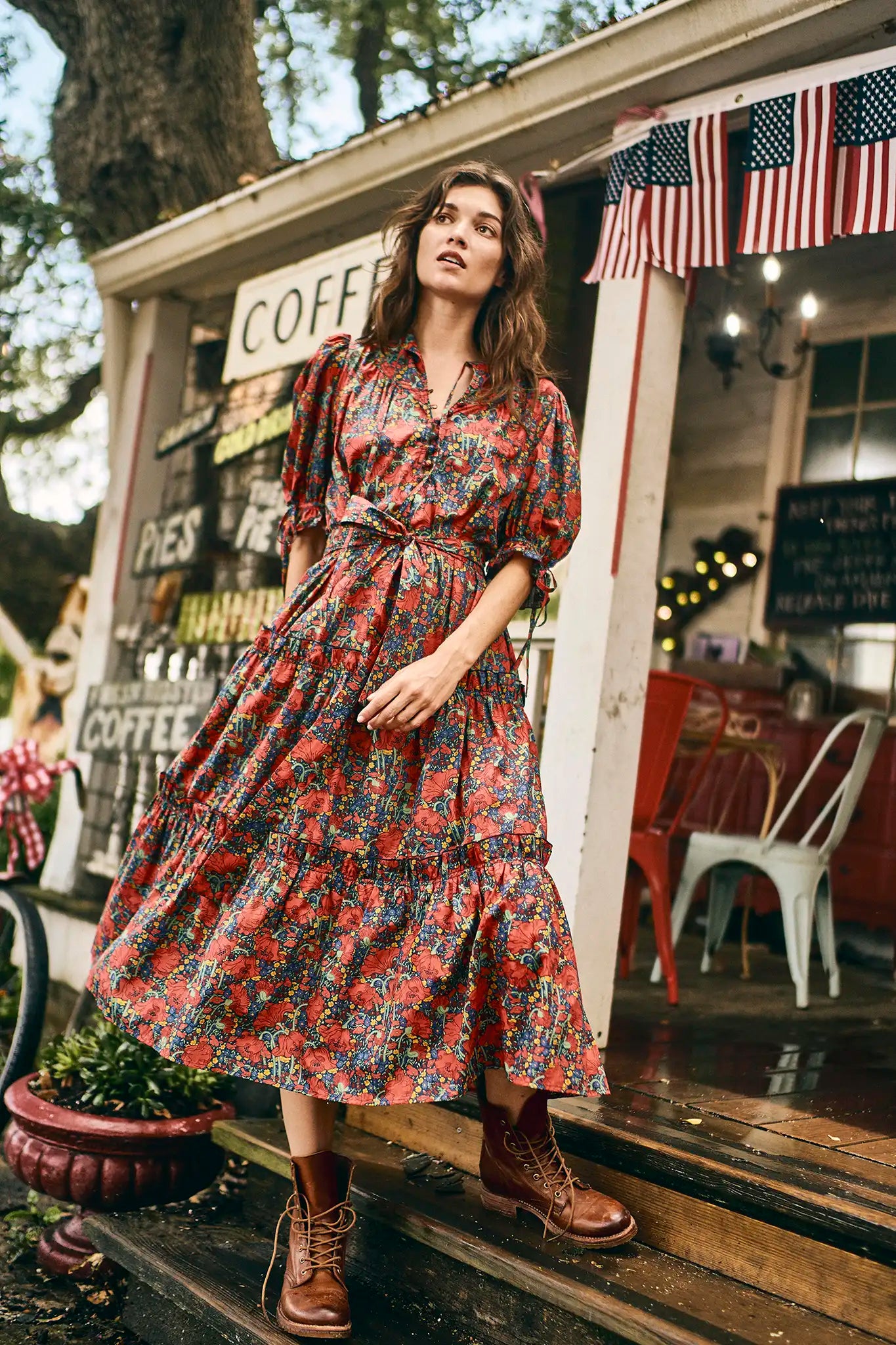 The Holloway Dress has v-neck, elbow-length puff sleeves, tiered ruffled seams and an optional sash.