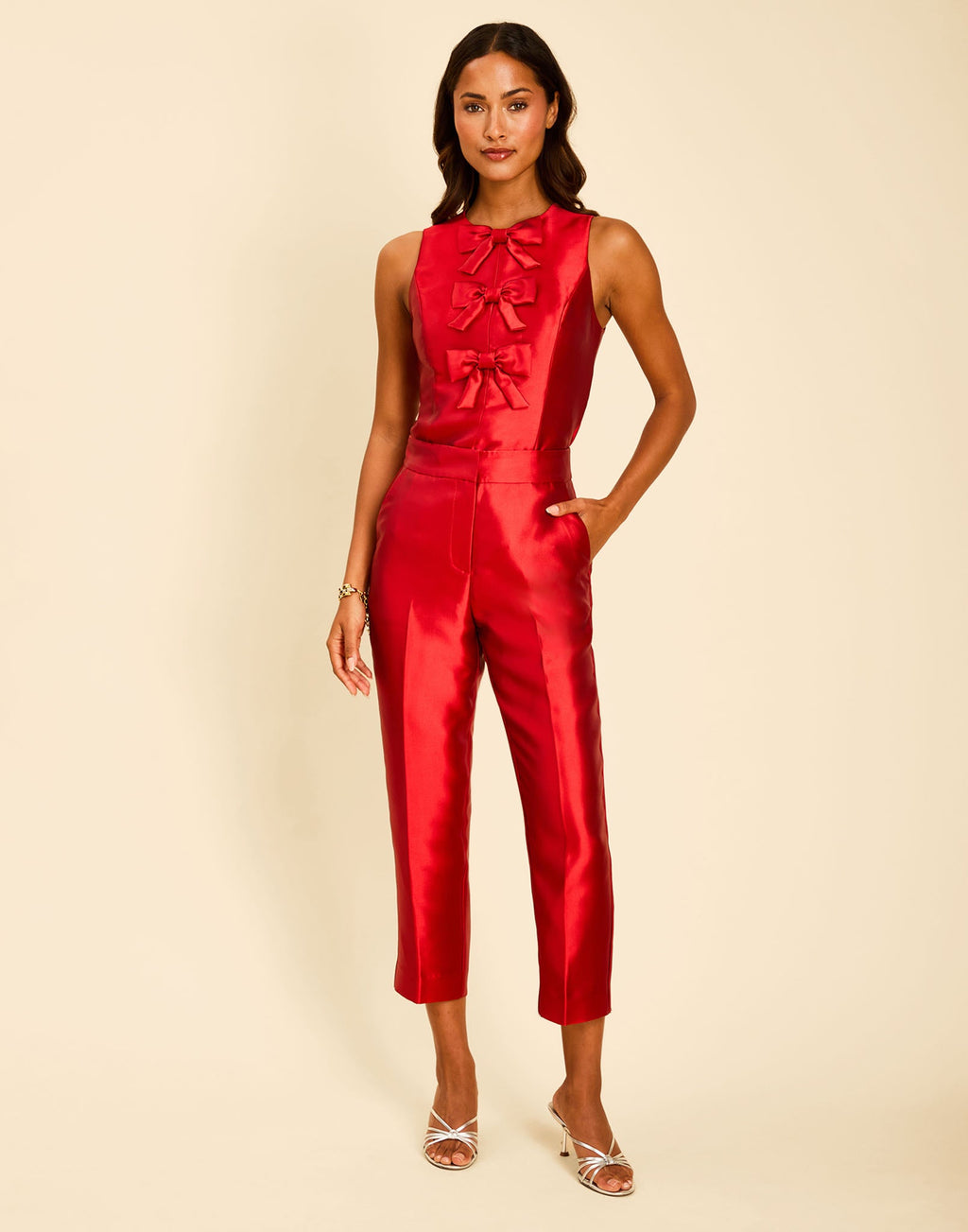 Hudson Bow Top in Merlot Red with a sleeveless crew neckline, three bows down the front, and peplum silhouette.
