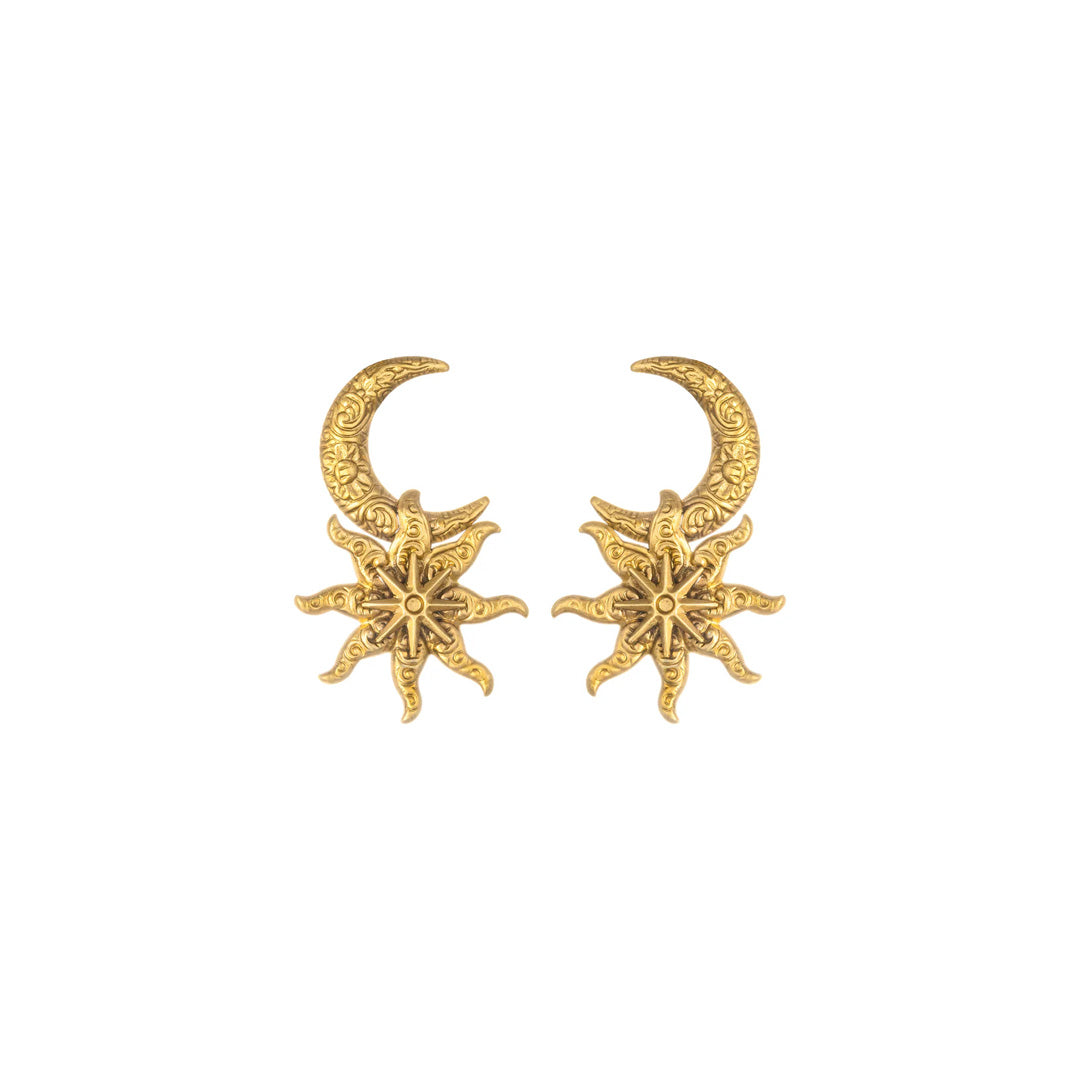 Front view of Apollo earrings showcasing engraved gold crescent moon with hanging sunburst motif on white background