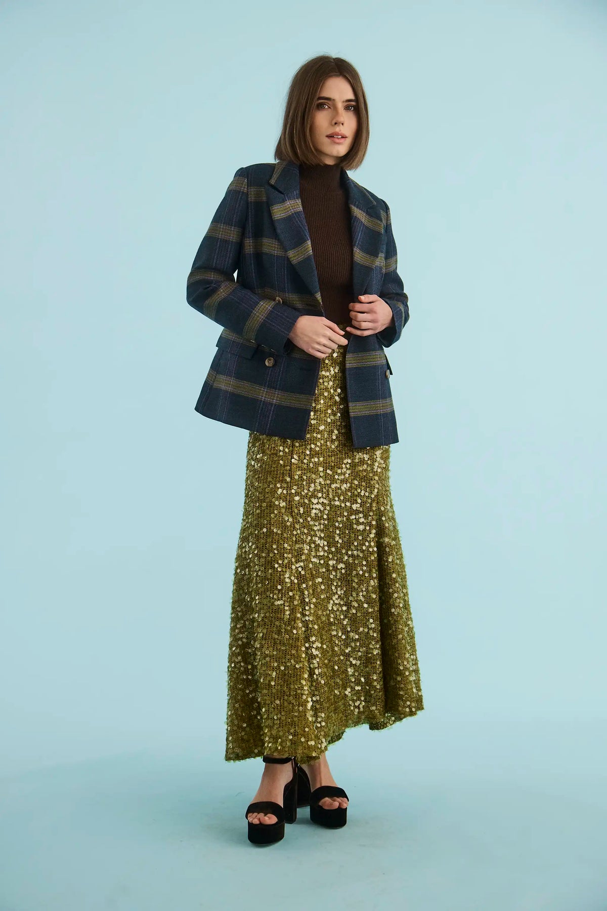 The Huntley Blazer in Stirling Plaid paired with the Lindsey Skirt in Moss Sequin. 