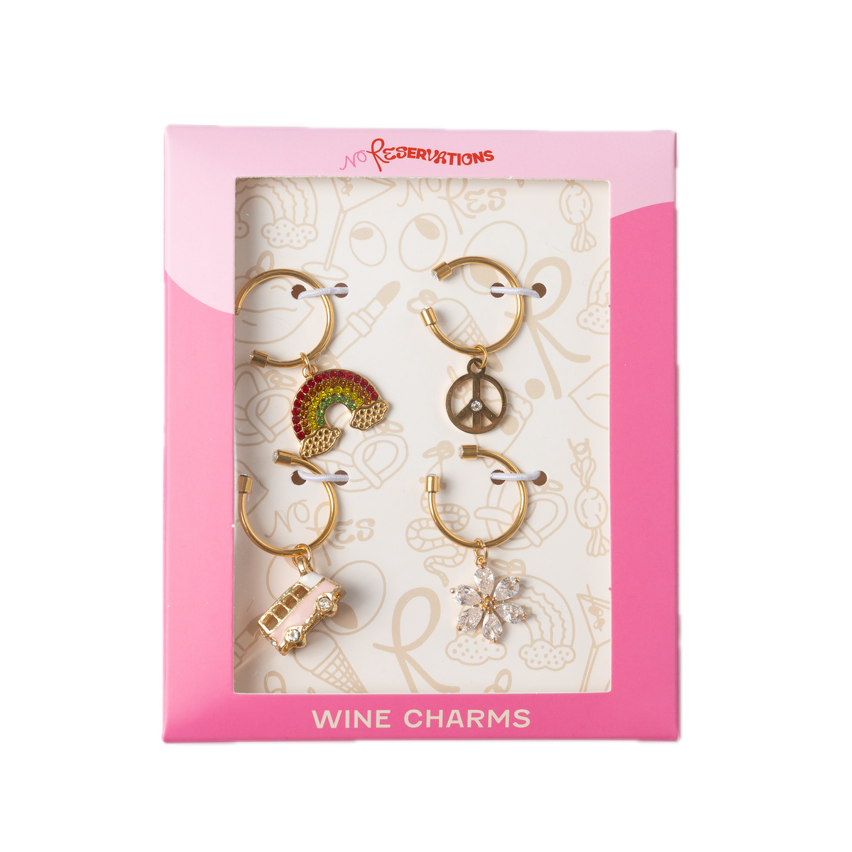 Packaged Groovy wine charm set with four gold-plated charms, rainbow, peace sign, vintage bus, flower, labeled WINE CHARMS