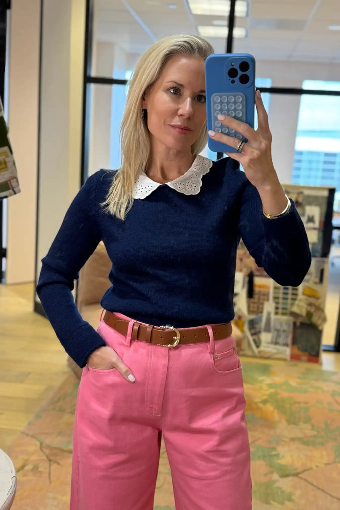 Fitted long-sleeve sweater with a delicate lace-look and eyelet-detailed collar. 