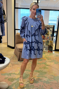 Blue cut-out embroidered linen, crew neckline, softly ruffled yoke, long sleeves with button cuffs