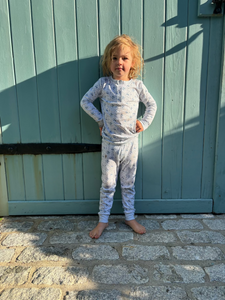 Front view of Farm Kids Henley Pajamas, Set of 2 showcasing the matching long-sleeve top and pants on a child outdoors