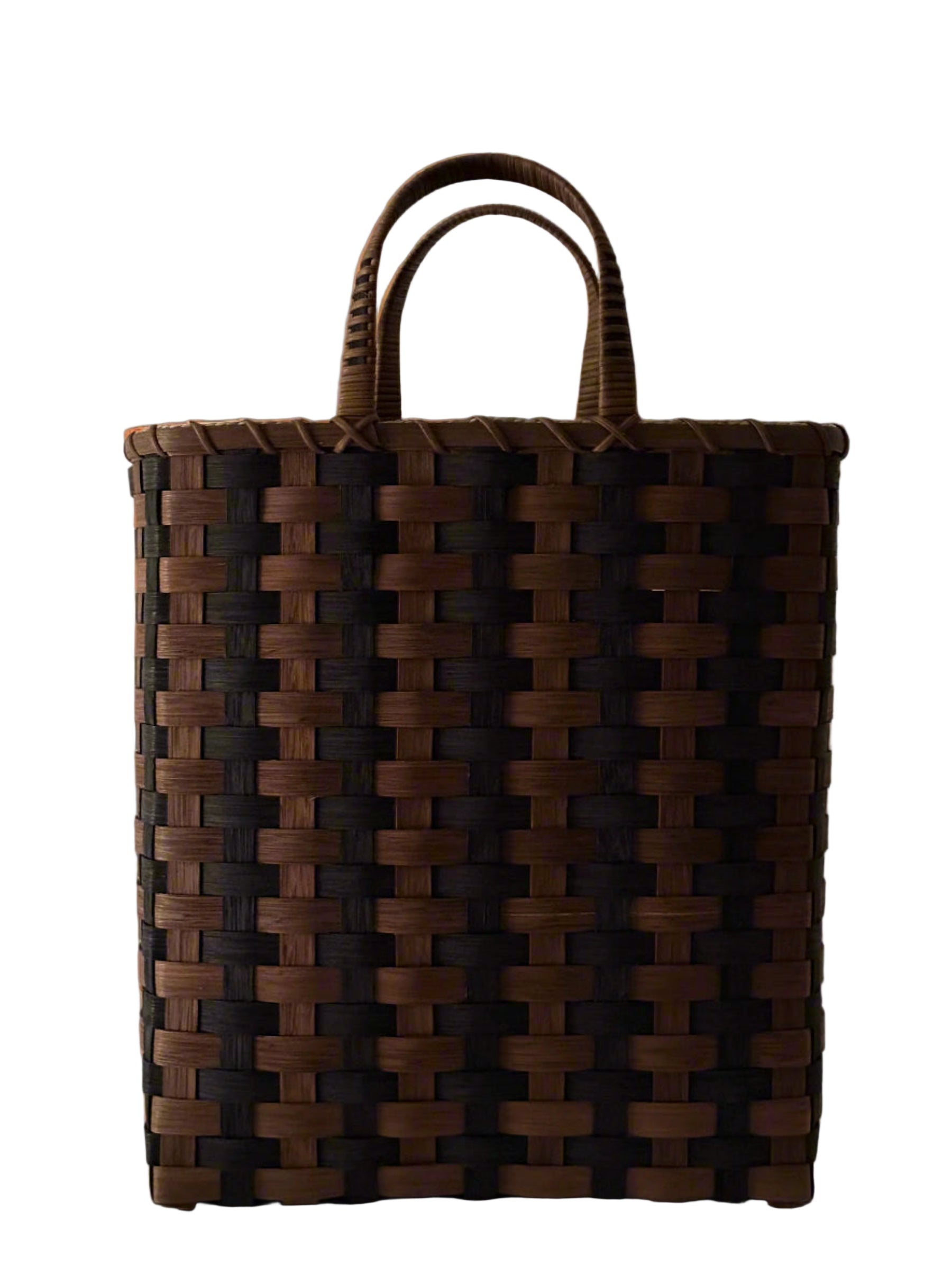 Woven brown bag with handles on a light gray background