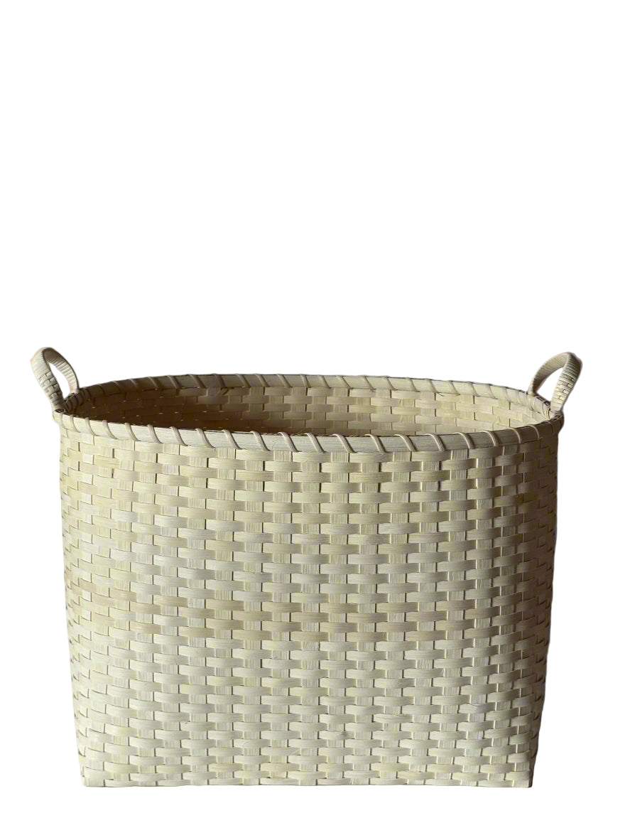 Front view of Oversized Bounty basket showcasing woven rattan texture and wrapped handles on white background
