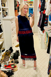 The Rivington Skirt is a midi in embroidered fringe wool, a clean finished waist and back zipper