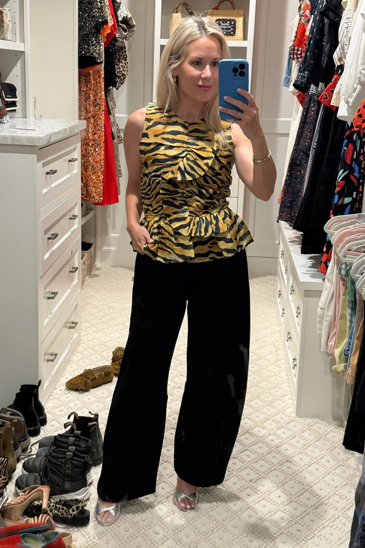 The Doering Top is a fitted V-neck silhouette with ruffles, shirring, and a peplum waist. 