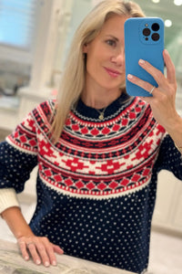 The Josie Sweater in St. Moritz Fair Isle has a ribbed crew neckline and long raglan sleeves.