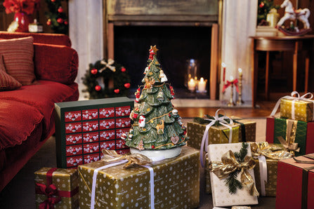 Front view of Christmas Toys Memory 3D Tree Advent Calendar in Multi showcasing its festive tree shape among wrapped gifts