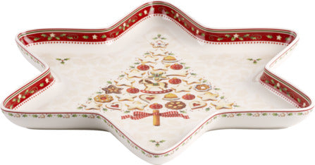 Top angled view of star-shaped Winter Bakery Delight porcelain bowl with Christmas tree motif and red rim on white background