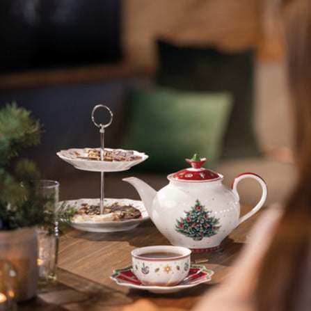 Toys Delight small tiered porcelain tray stand displayed on wooden table with matching teapot and cup in cozy holiday setting