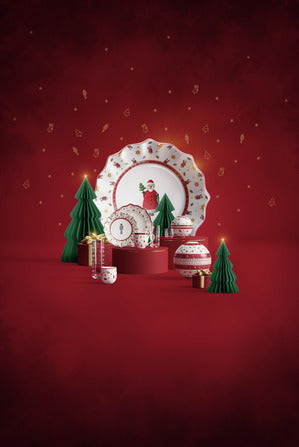Front view of Toys Delight breakfast set for 2 with nutcracker motif on porcelain plates, mugs, and bowls on red background