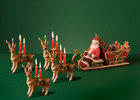 Front view of Christmas Toys Memory Santa’s sleigh with four reindeer, hand-painted porcelain with gold accents on green background
