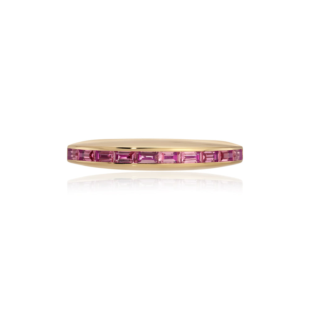 Profile view of Eclipse Ring showcasing pink baguette sapphires channel-set in an 18k yellow gold band on white background