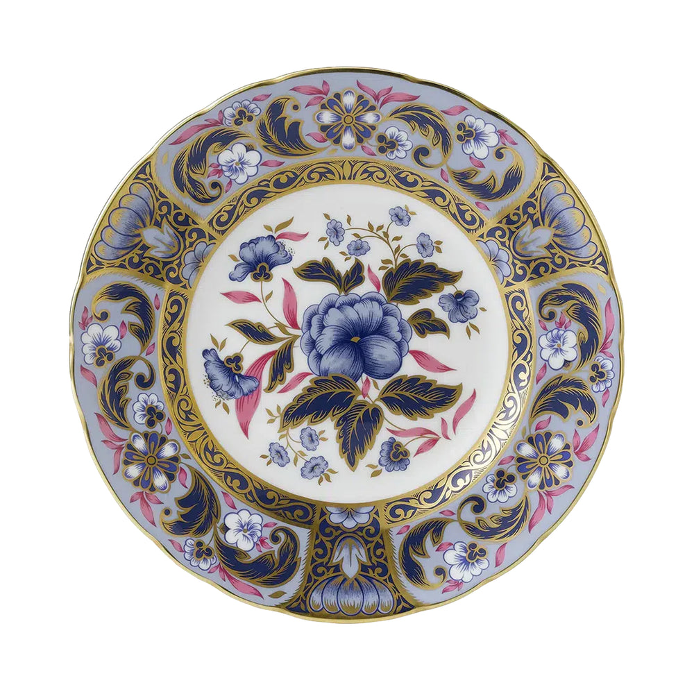 Top view of Imari Accent Collection plate showing blue camellia floral pattern, pink accents, and 22 carat gold rim on white background