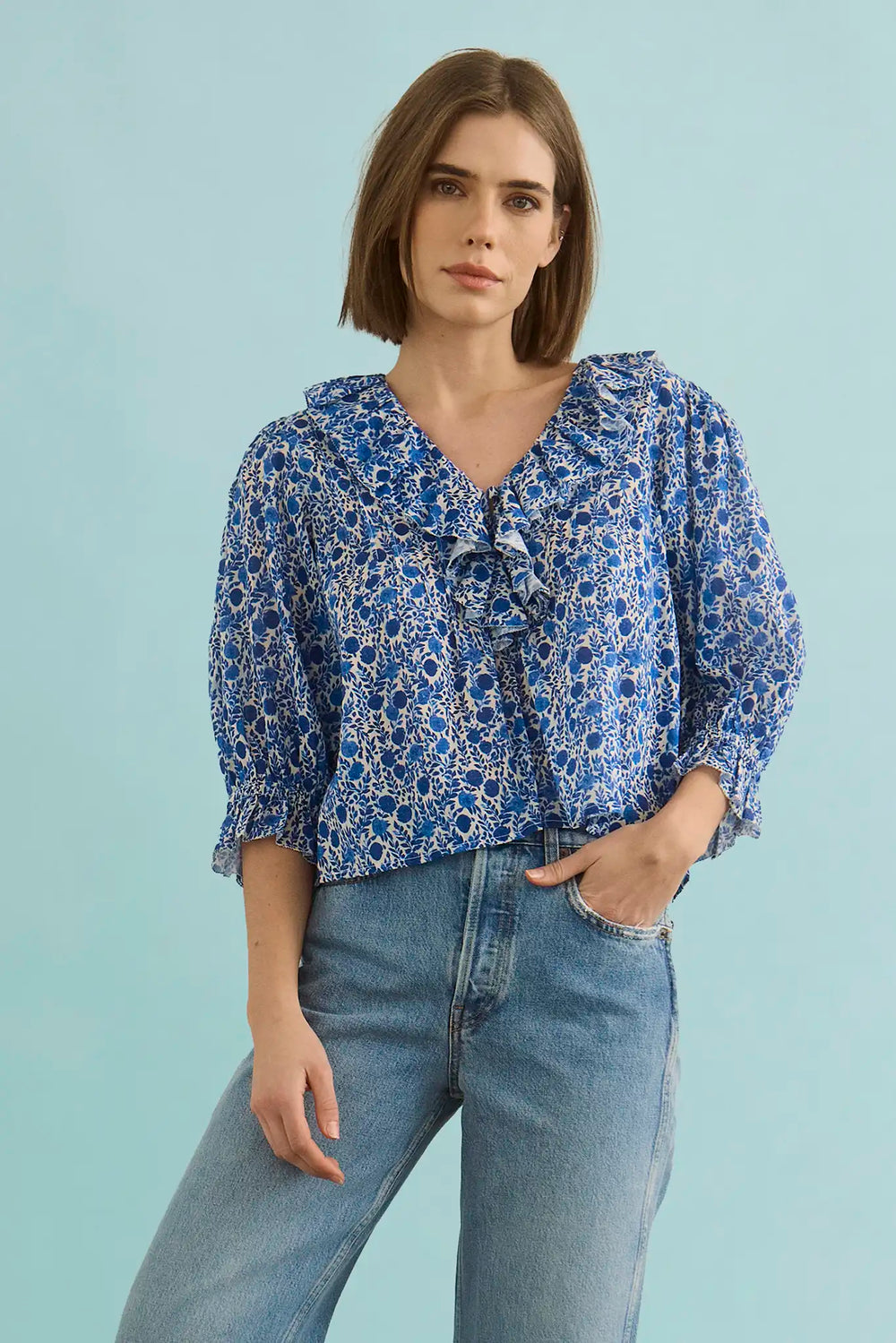 The Imogen Blouse in Bermuda Blooms paired with denim.