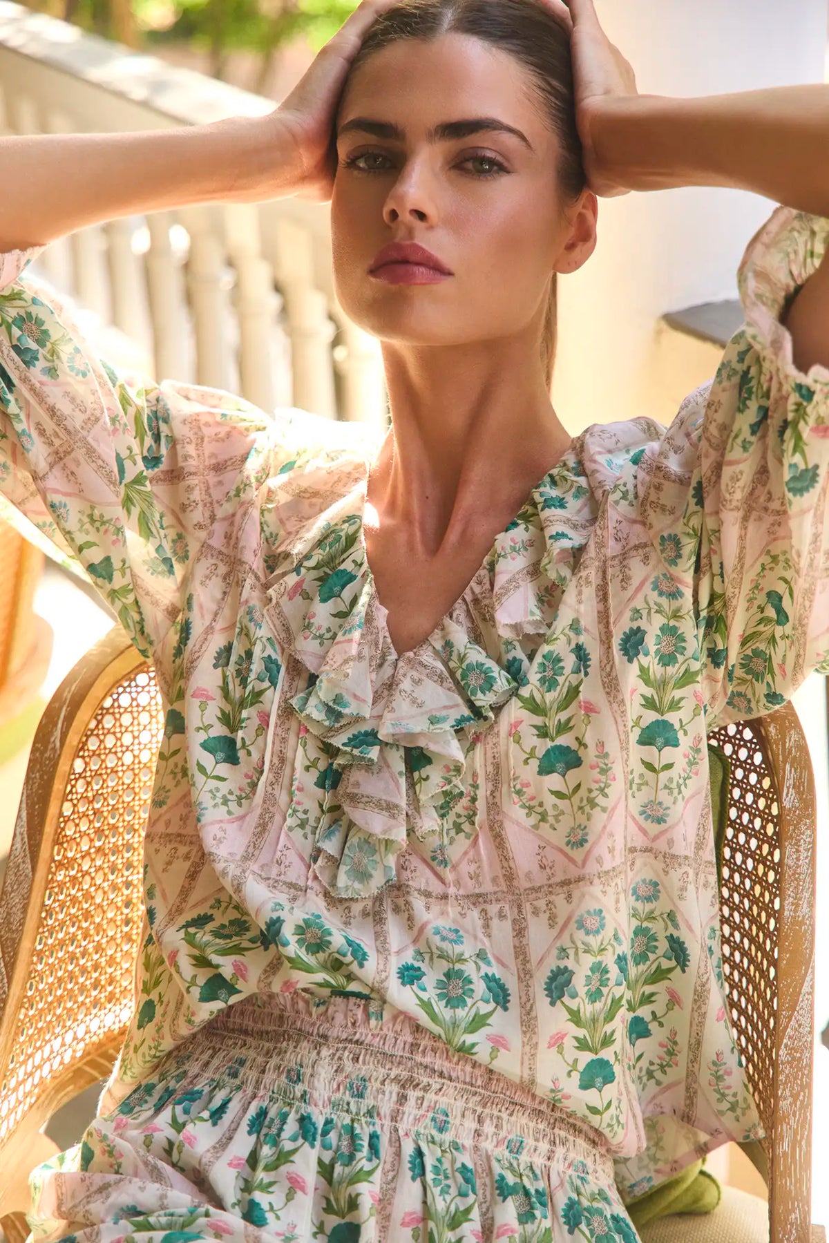The Imogen Blouse, cotton voile ruffle blouse, in Pink Trellis paired with matching Jemma Shorts.