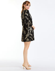 Ines Caftan Mini Dress in Black/Gold side – metallic lurex cocktail shift dress with djellaba collar, bell sleeves, and side seam pockets by Mestiza New York.