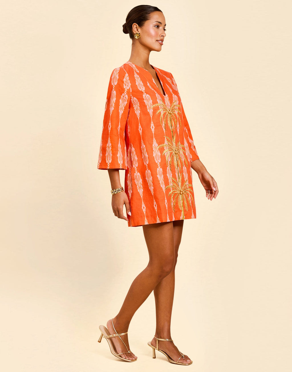 Ines Caftan Mini Dress in Hibiscus Mosaic linen with embroidered palm details, djellaba collar, and relaxed caftan silhouette.
