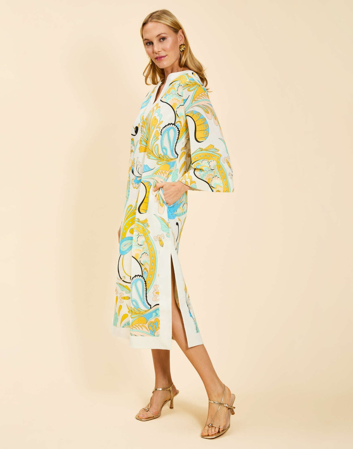 Ines Midi Caftan in Marble Rhapsody with Djellaba-style neckline, relaxed sleeves, side slits, and functional hand pockets.