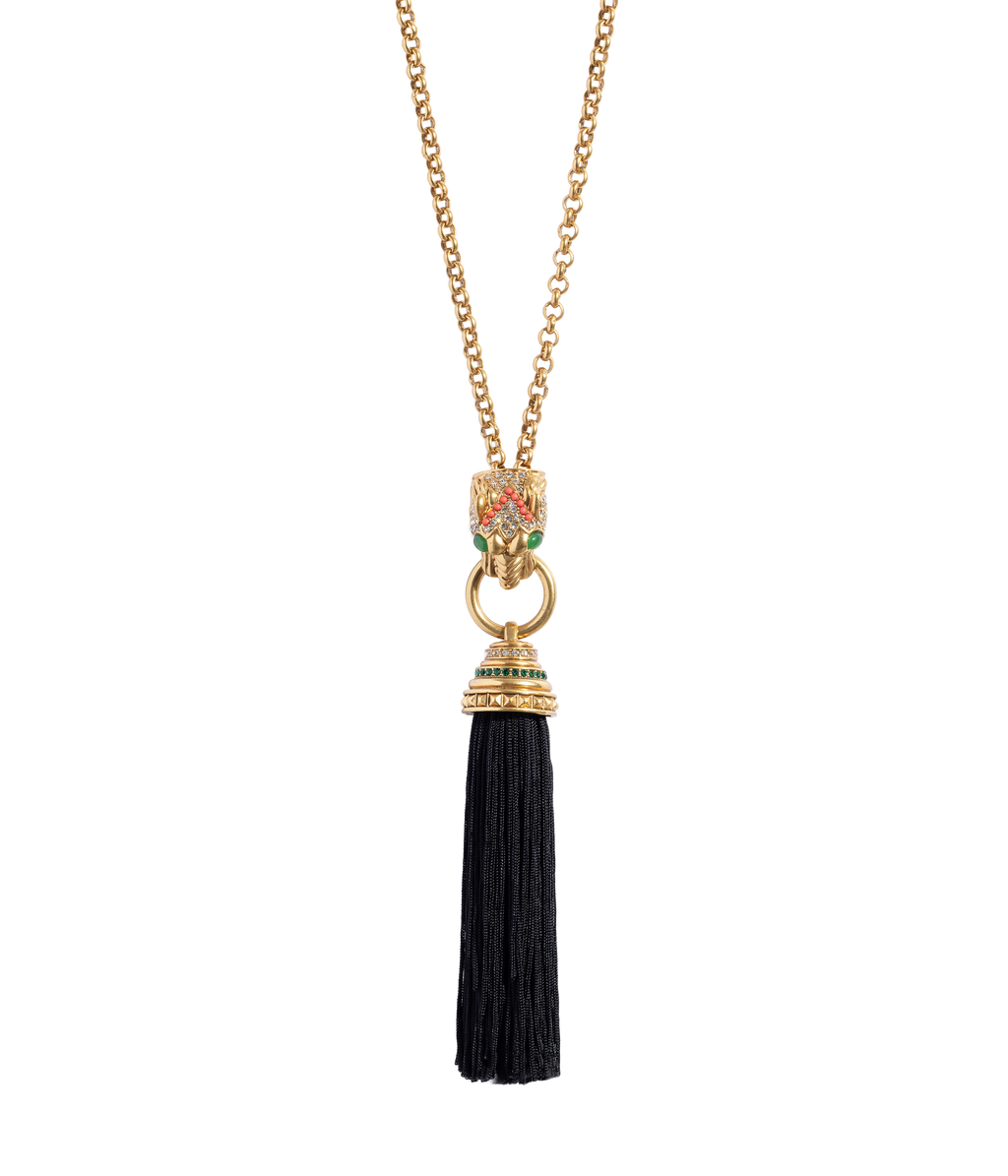 Front view of Ingrid Panther Necklace showing a jeweled panther pendant clutching a black silk thread tassel on a black background