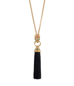 Front view of Ingrid Panther Necklace showing a jeweled panther pendant clutching a black silk thread tassel on a black background