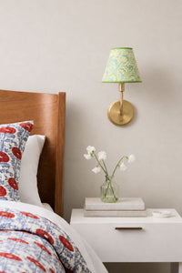 Seaglass peacock clip-on sconce mounted on wall