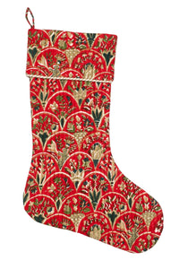 Red blockprint holiday stocking with floral patterns and arch designs