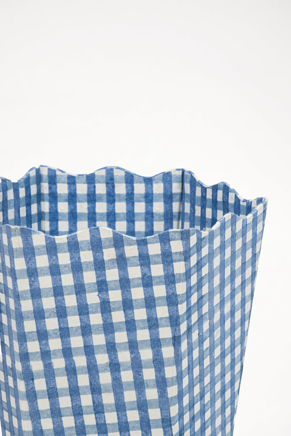 Close-up of blue gingham waste bin storage bin