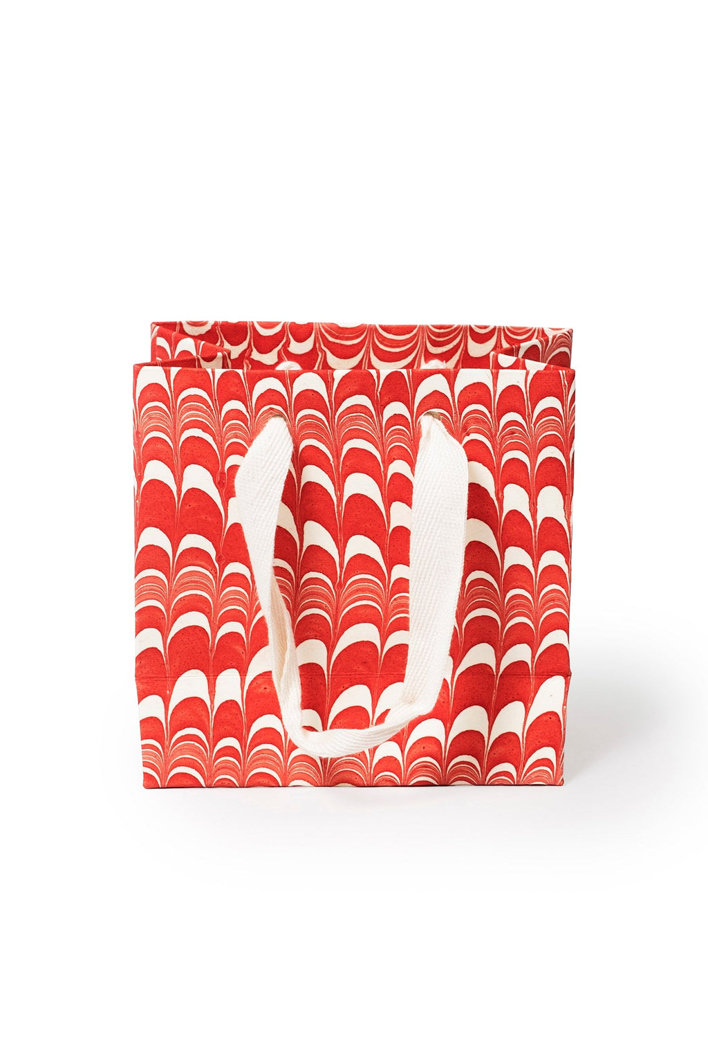 Small red and white candy cane swirl hand marbled gift bag with white handles by Inner Child