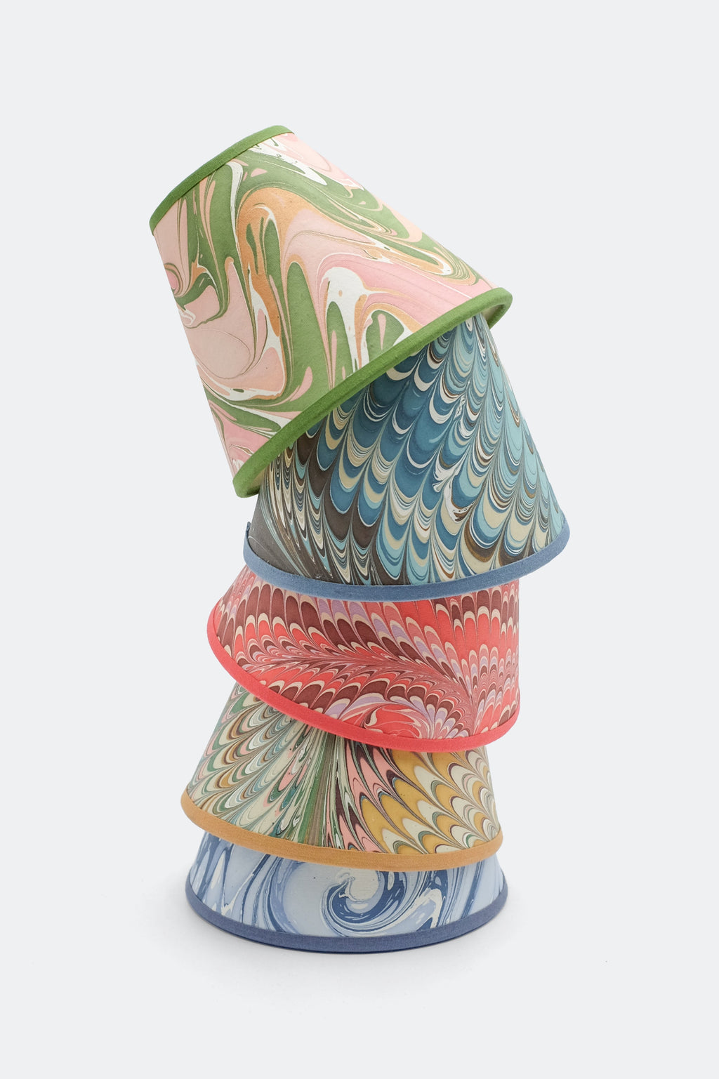 Stacked 6" hand-marbled clip-on lampshades with peony bloom patterns