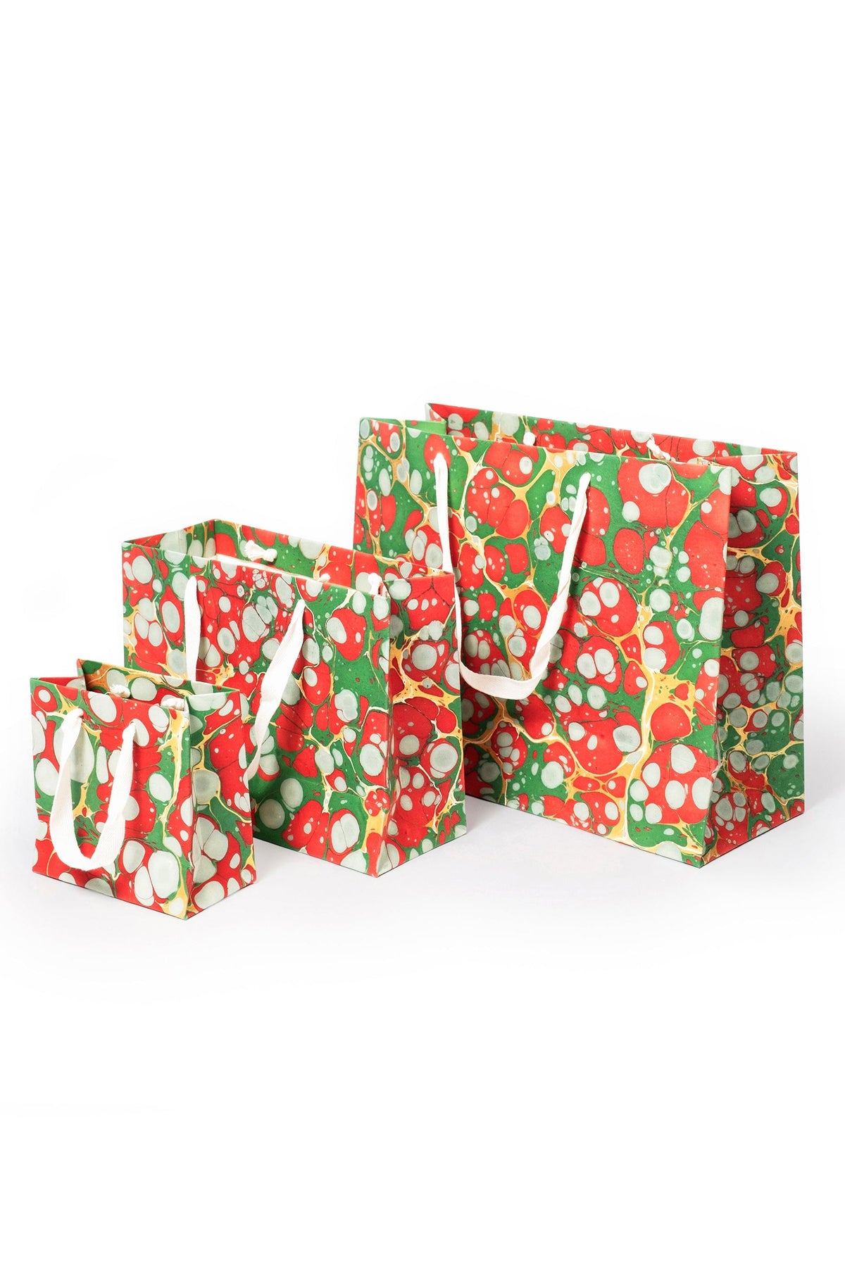 Set of Christmas Gems hand-marbled gift bags in red, green, white, and gold with white handles, including small, medium, and large sizes.