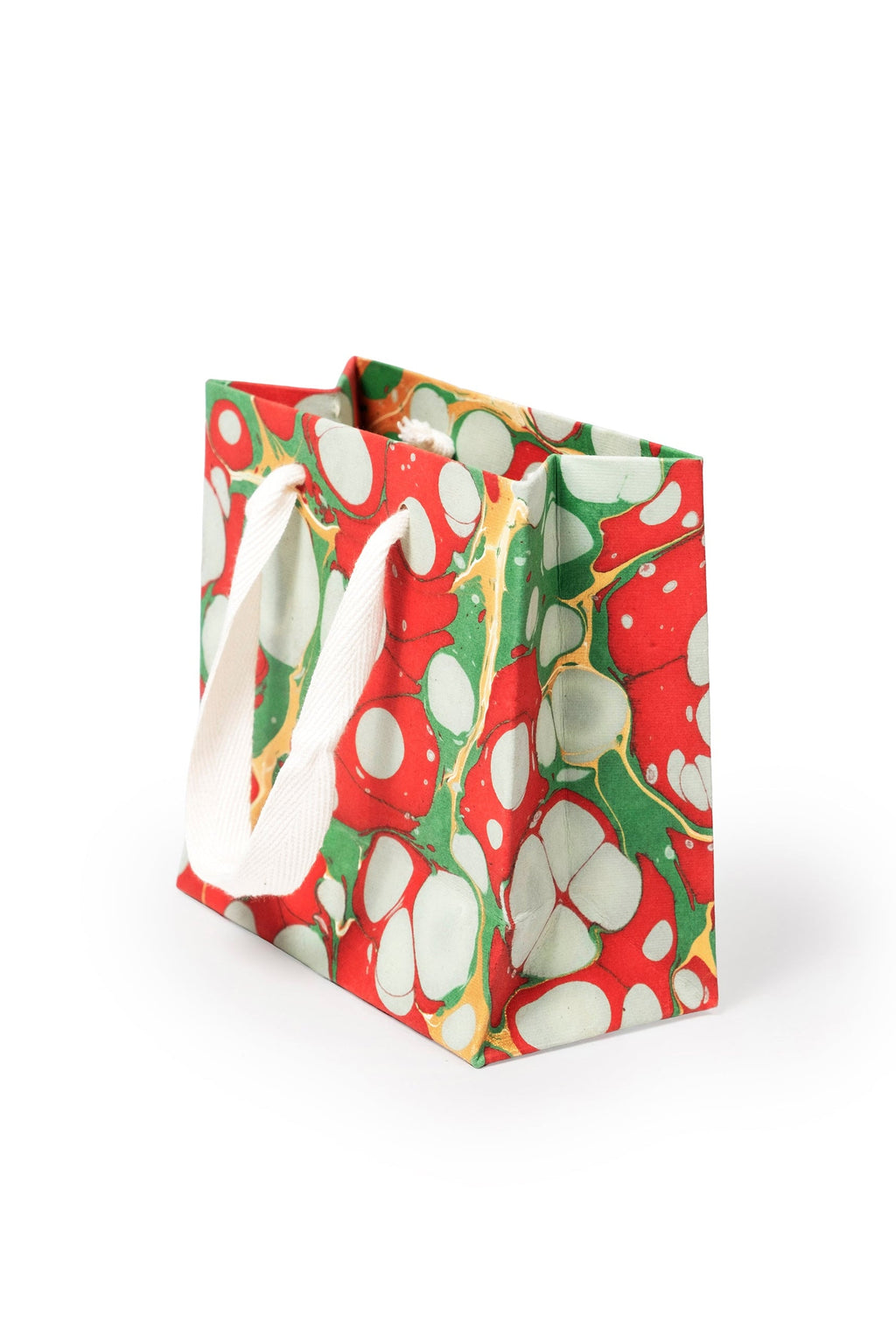 Hand-marbled Christmas gift bag with red, green, white patterns and white handles